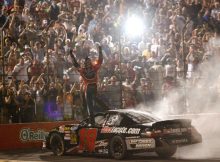 Kyle Busch salutes the fans after doing a burnout to celebrate his Kroger 200 win at O'Reilly Raceway Park. Credit: Tom Pennington/Getty Images for NASCAR